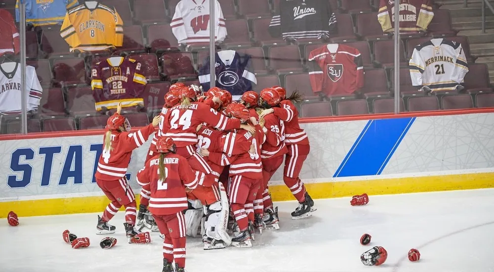 Wisconsin women's hockey team celebrating on the ice