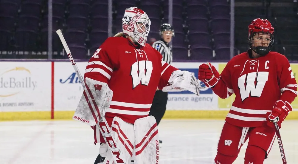 Bre and a Wisconsin teammate on the ice